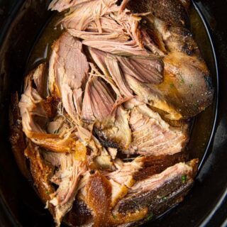 Kalua Pork in slow cooker cooked and partially shredded 1x1