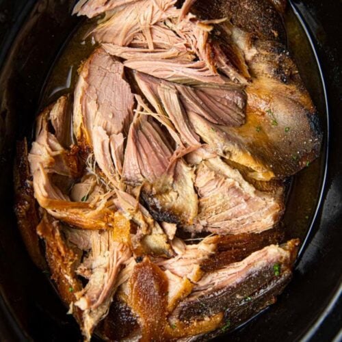 Kalua Pork in slow cooker cooked and partially shredded 1x1