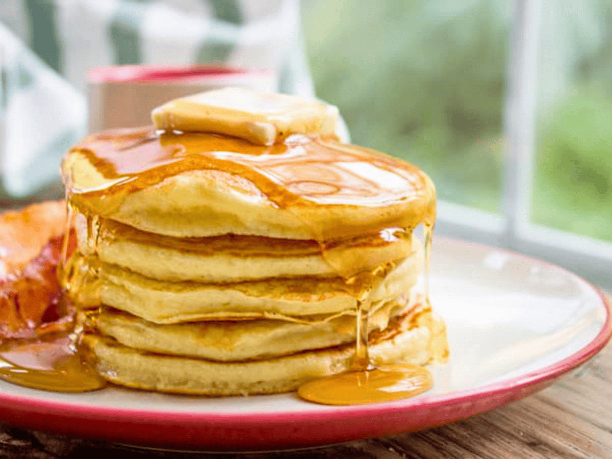 Stack of pancakes with butter and syrup