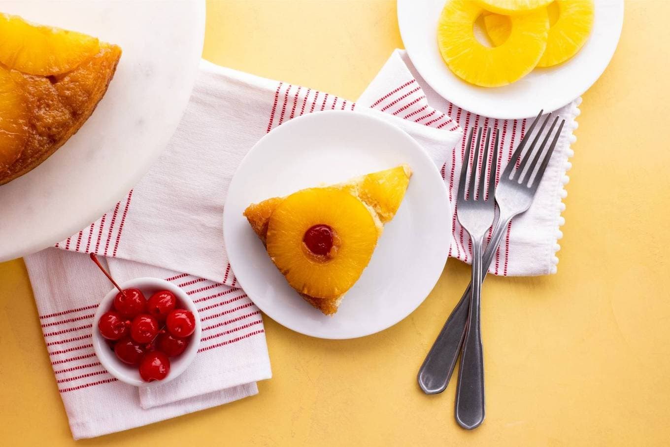 Pineapple Upside Down Cake slice on plate with fork