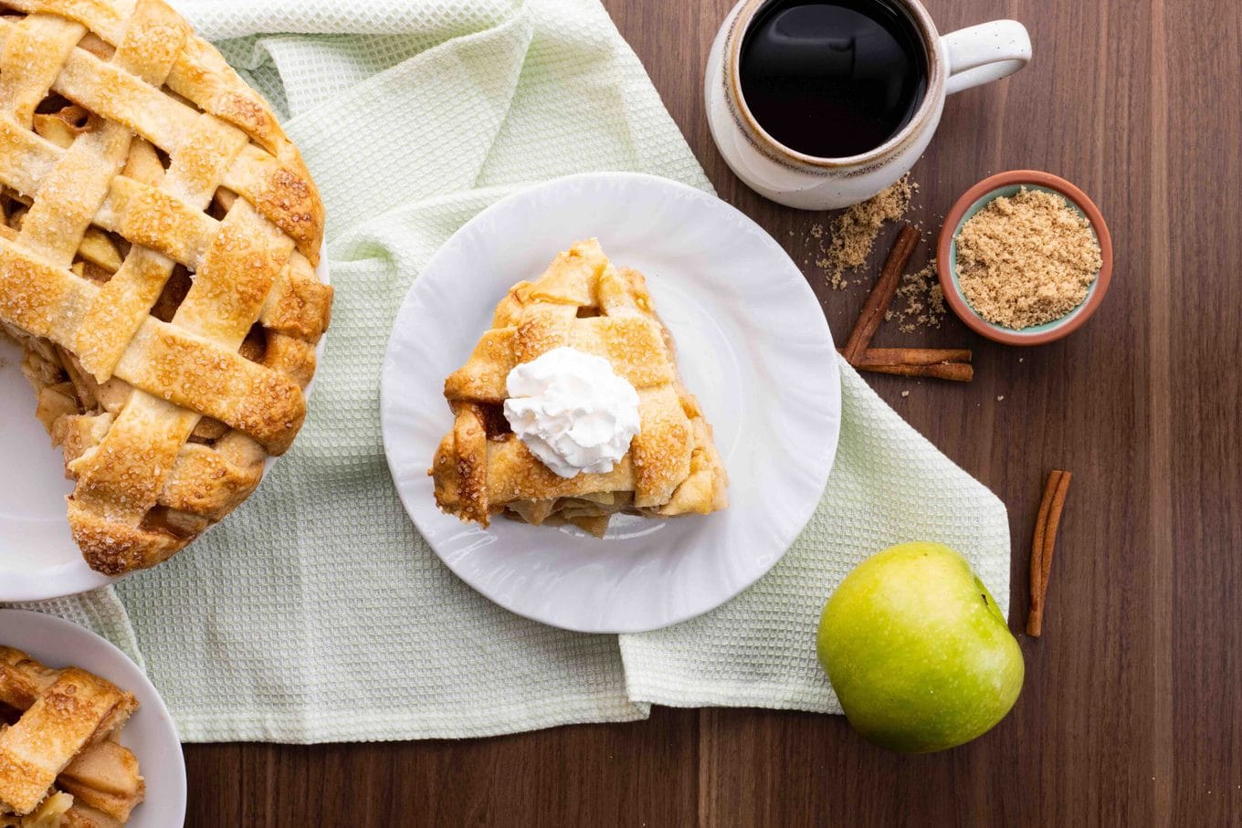 Classic Apple Pie Slice on plate with coffee cup