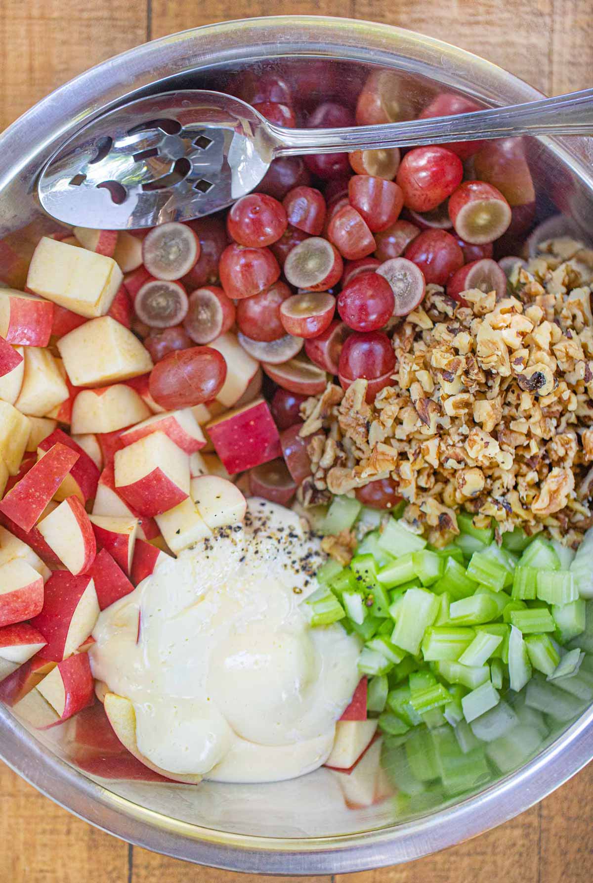 Ingredients of Waldorf Salad in metal bowl