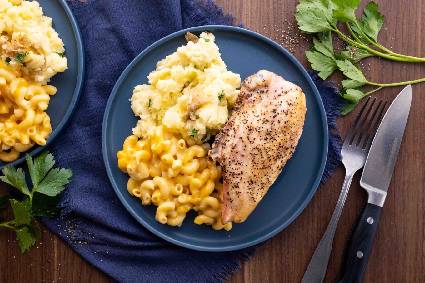 Oven Baked Split Chicken Breasts on plate with sides