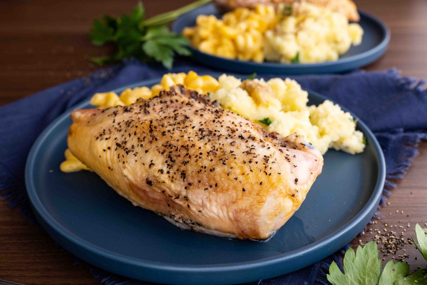 Oven Baked Split Chicken Breasts on plate with sides