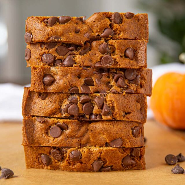 stack of 6 pumpkin bread slices with pockets of chocolate