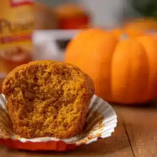 Muffin with pumpkin in the backgrouns