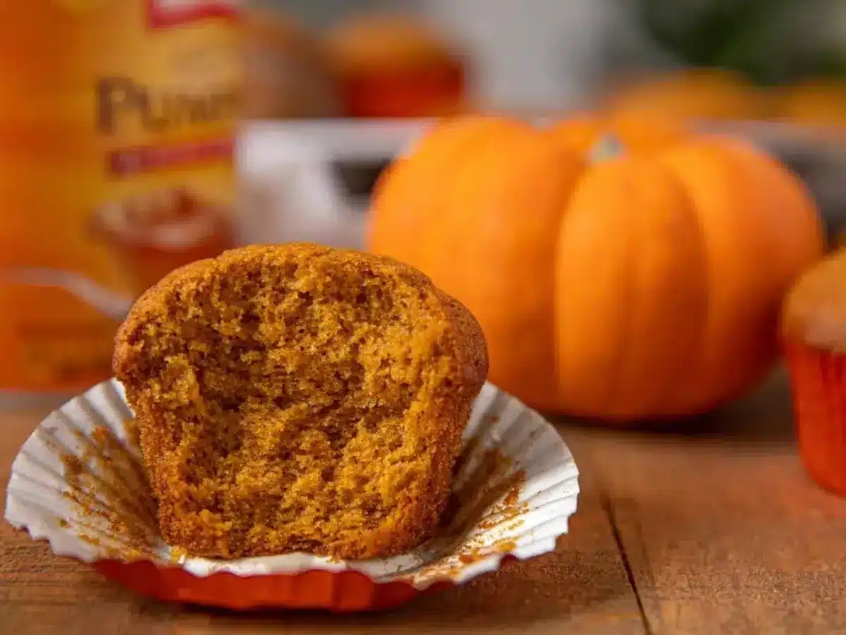 Muffin with pumpkin in the backgroun