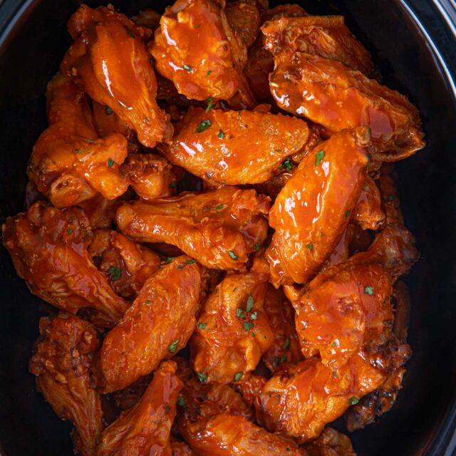 Slow Cooker Buffalo Wings in black pot