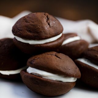 Plate full of chocolate whoopie pies with marshmallow fluff filling