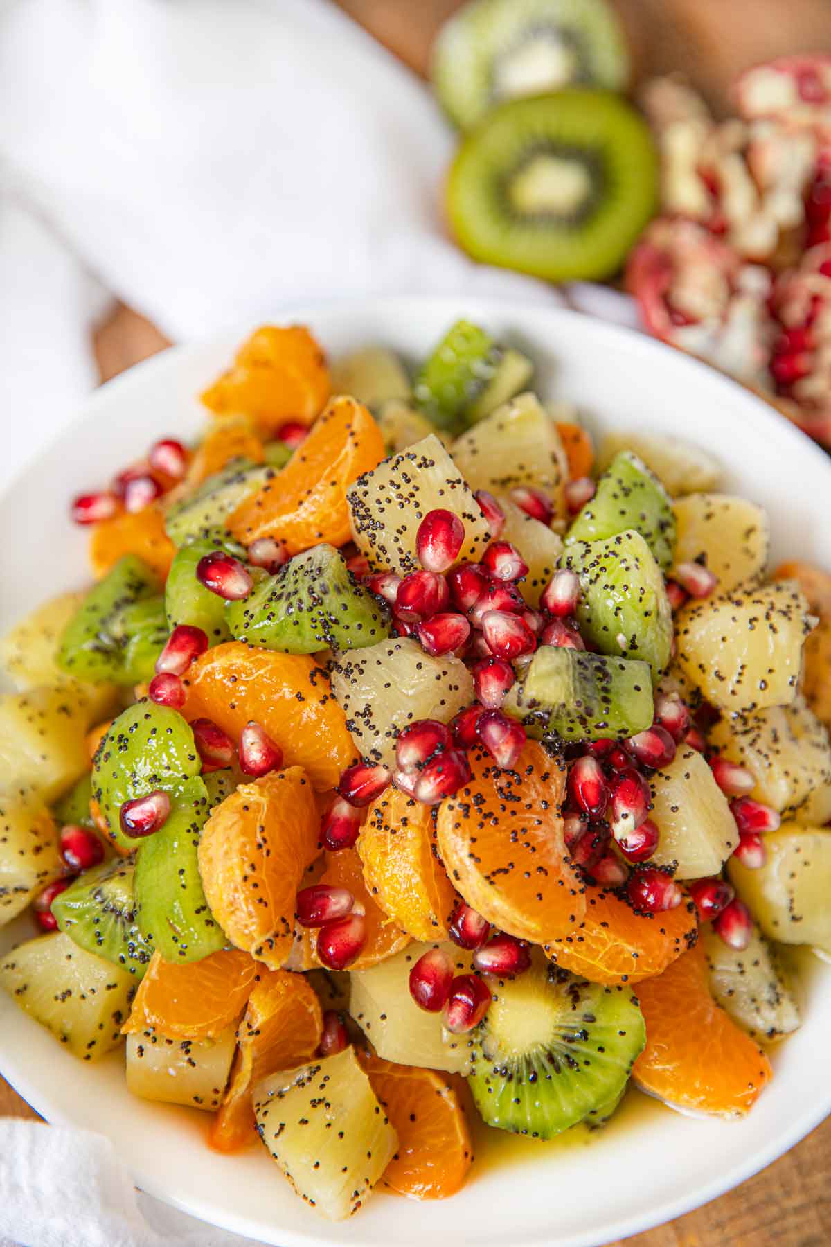 Winter Fruit Salad with Honey Poppy Dressing in White Bowl