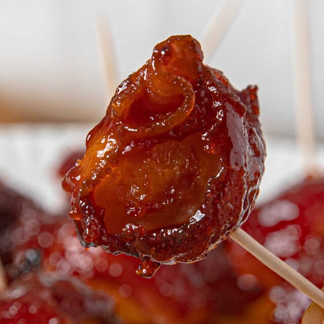 veggie wrapped in bacon with a bite taken out on Stick