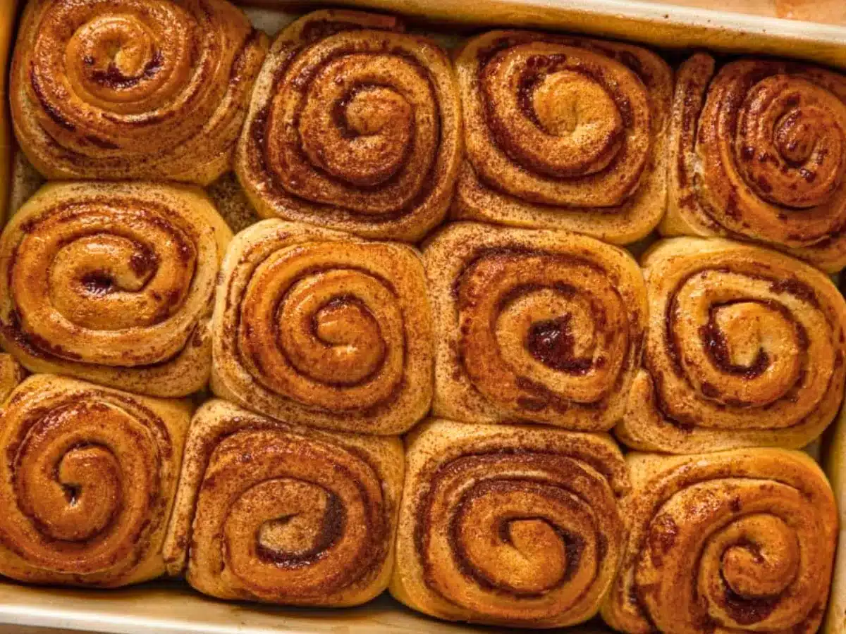 unfrosted cinnamon buns in a pan