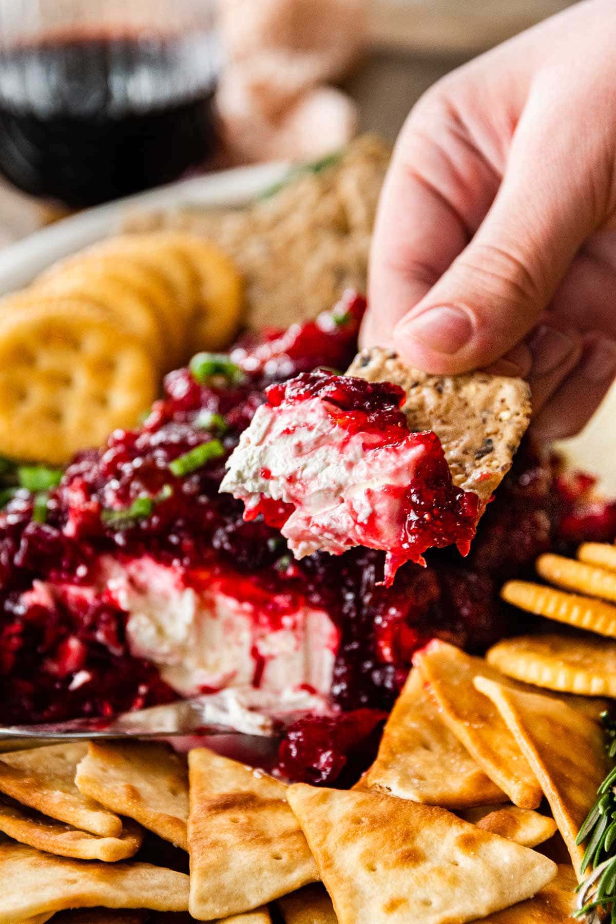 Cranberry Dip being dipped on serving platter