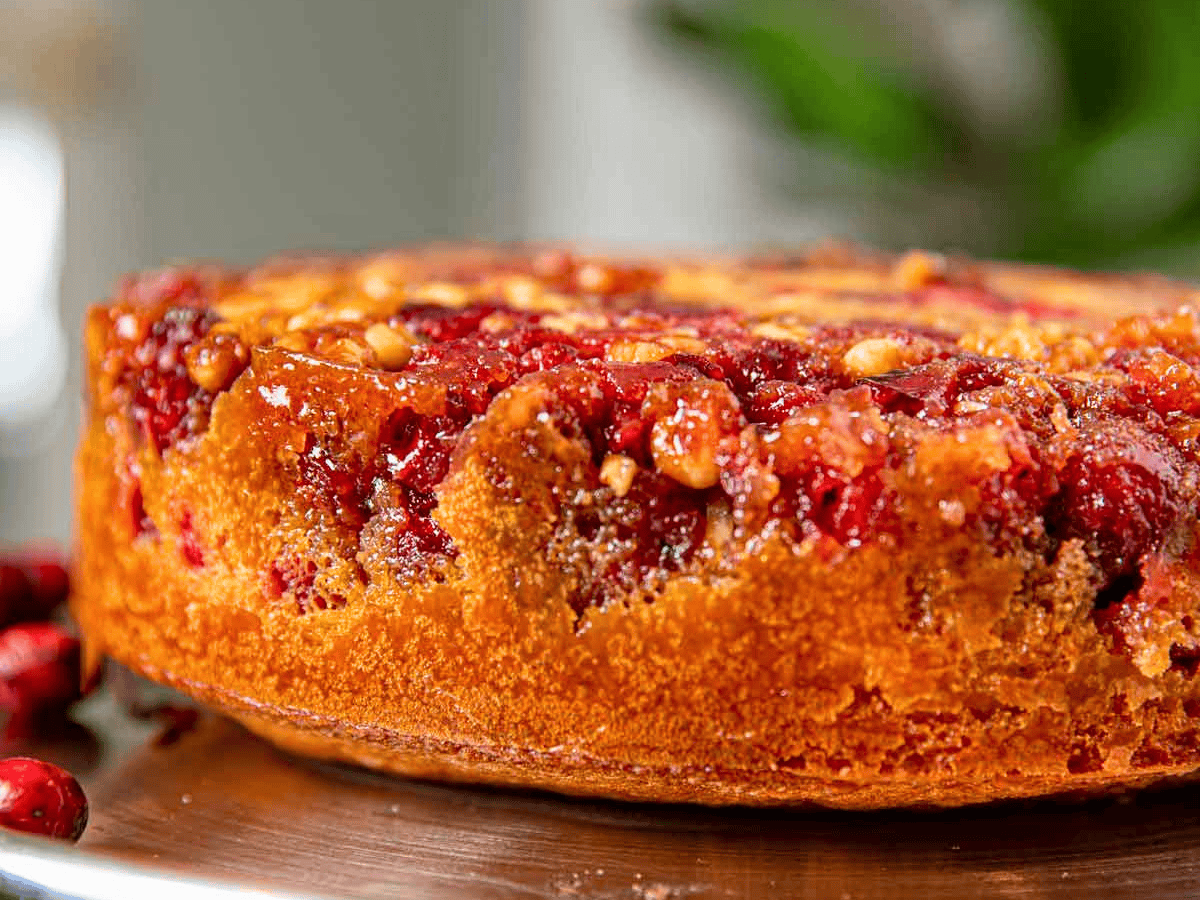 tart berry with nuts inside of cake on silver platter