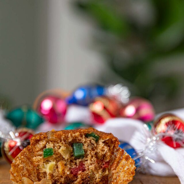 Fruit Cake Muffin with christmas lights behind it