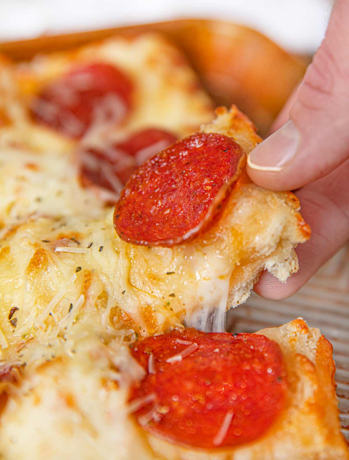 Piece of Pepperoni Cheese Bread being pulled