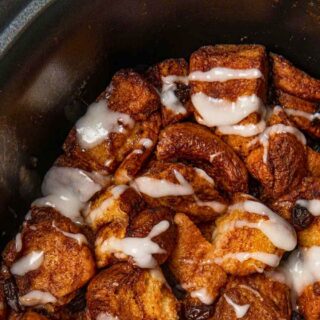 Slow Cooker Cinnamon Roll Casserole in a metal dish