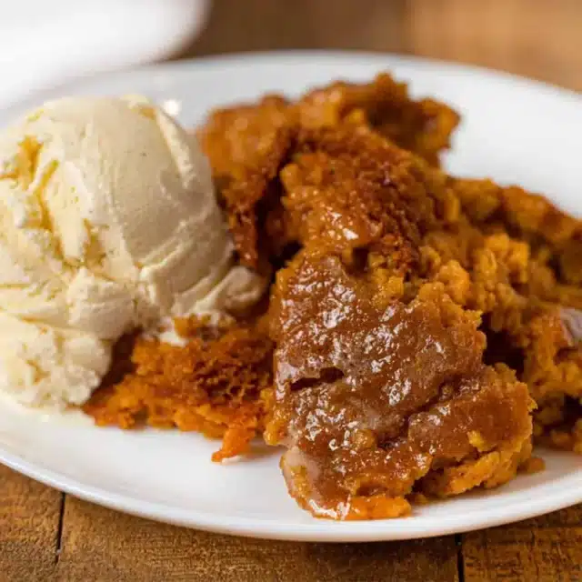 Pie pudding served on plate with ice cream