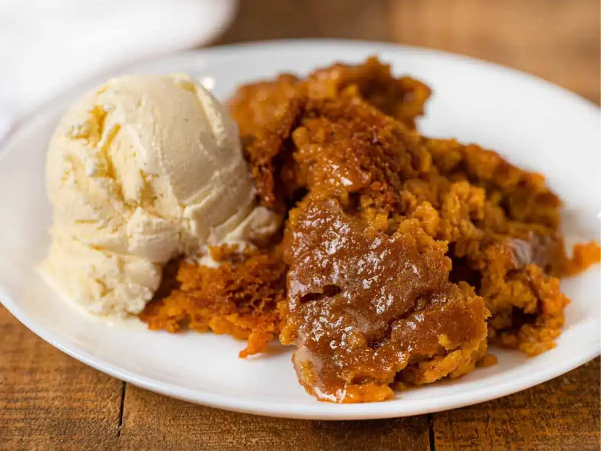 Pie pudding served on plate with ice cream