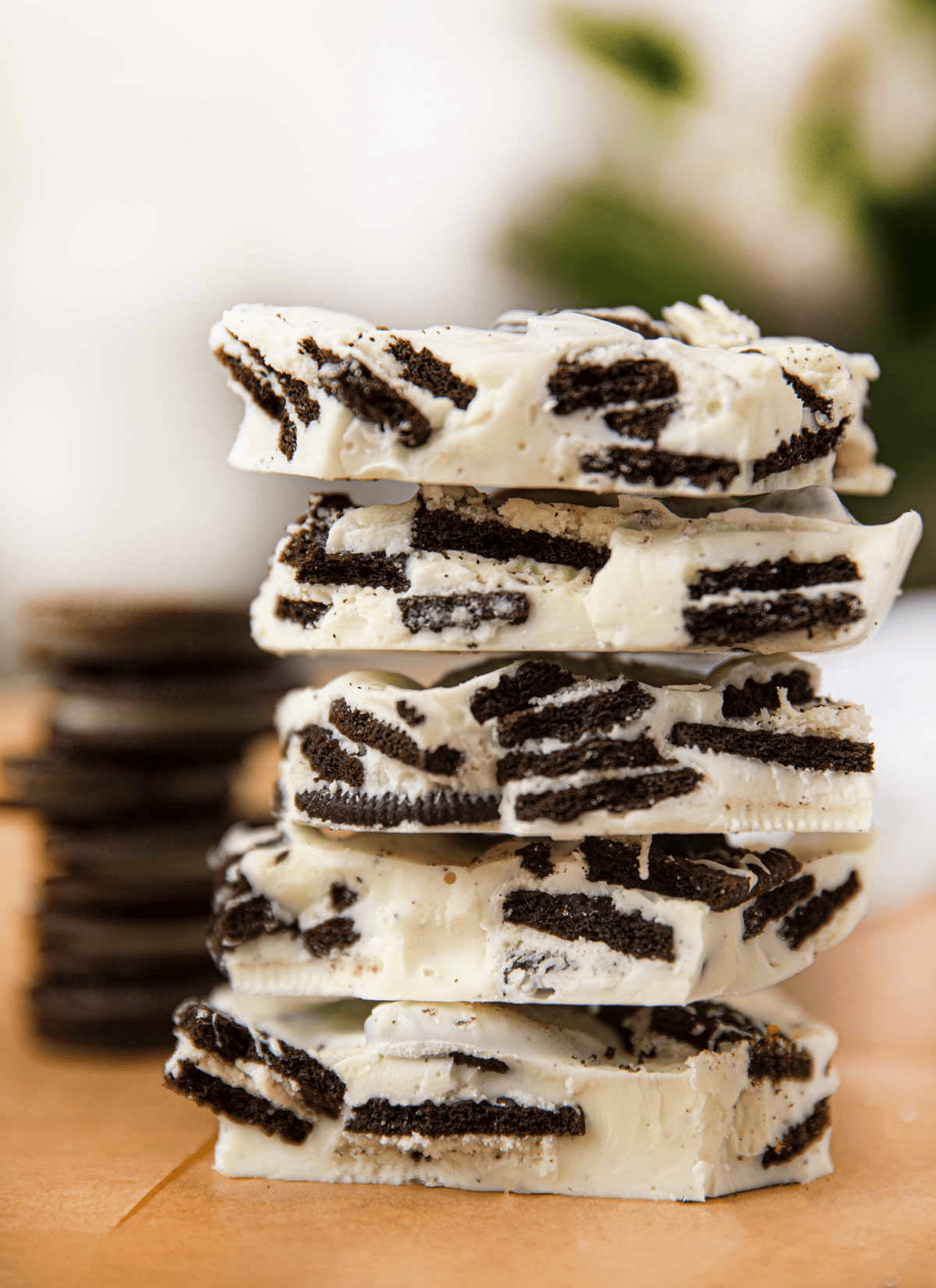 Stacked homemade cookies and white chocolate bark