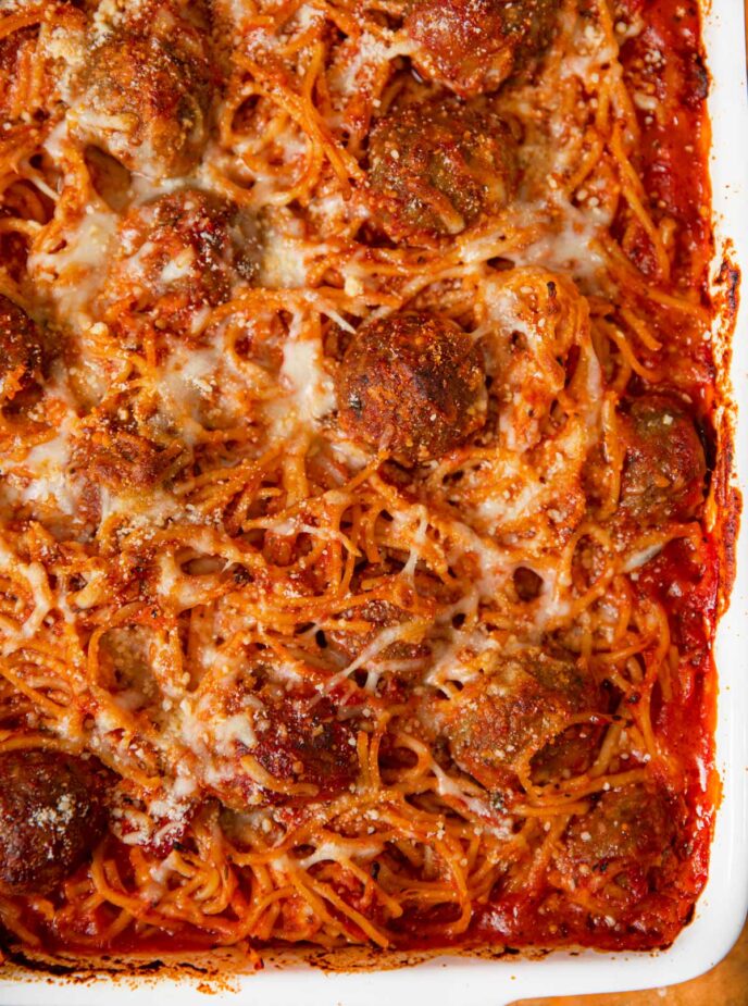 Quarter pan of baked spaghetti and meatballs