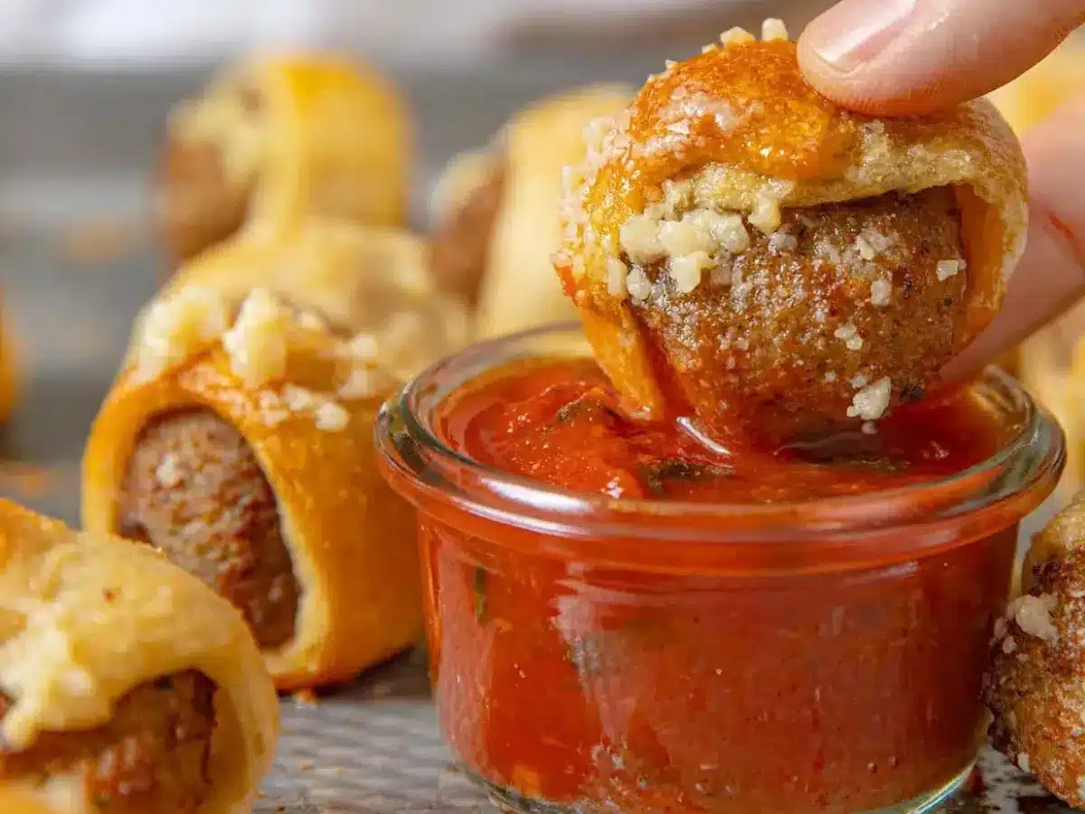 Bite being dipped in sauce