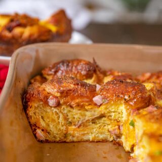 Slice of Ham Croissant Casserole cut out of baking dish