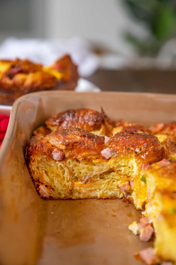 Slice of Ham Croissant Casserole cut out of baking dish