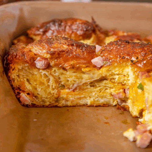 baking pan with a slice of breakfast casserole removed