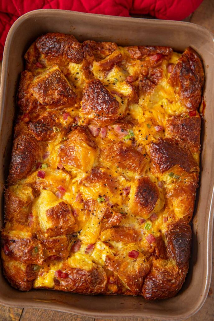 Ham and Egg Croissant Casserole in brown baking dish