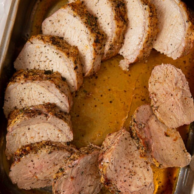 Boneless Pork Loin Roast Carved into a roasting pan fanned out