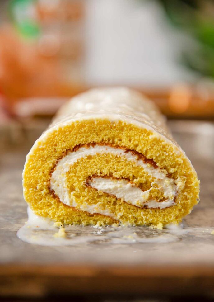Lemon Cake Roll on baking sheet with glaze