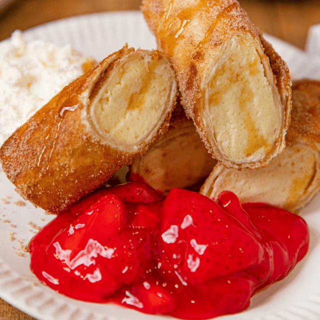 Dessert cut on a plate with strawberry glaze ready to eat
