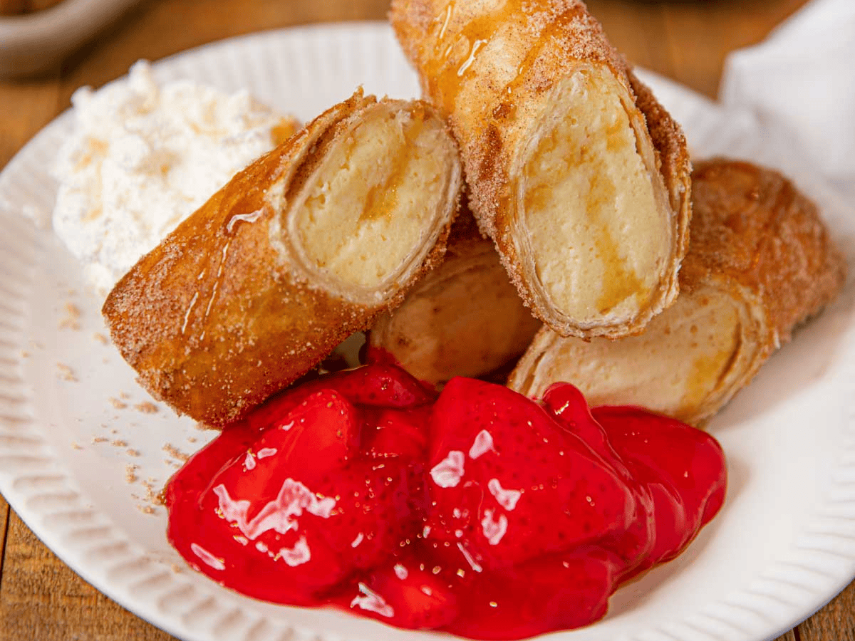 Dessert cut on a plate with strawberry glaze ready to eat
