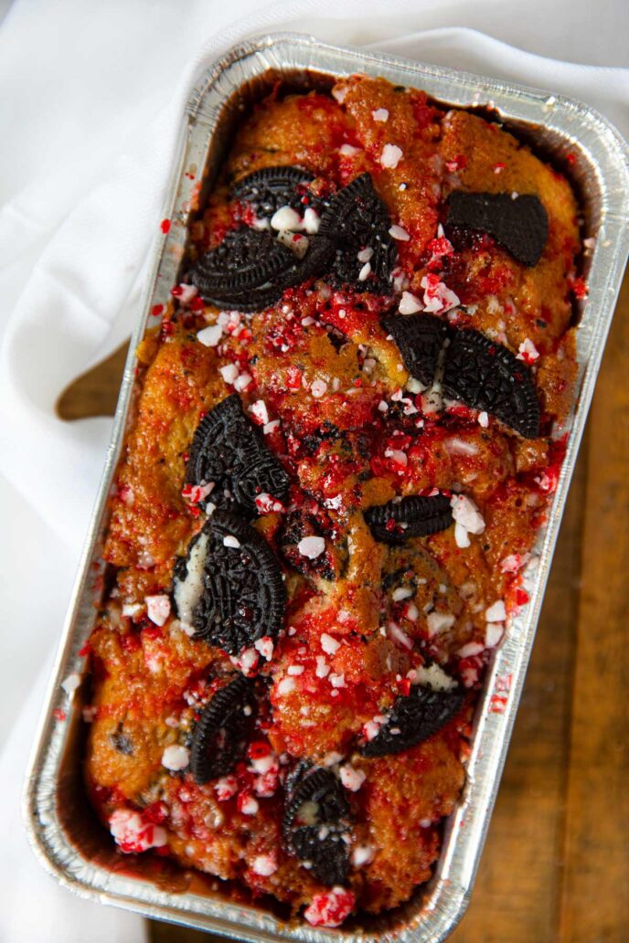 Loaf of Oreo Peppermint Bark Bread in baking tin