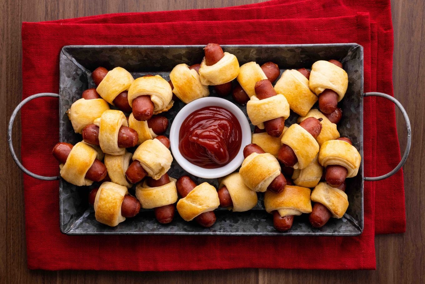 Pigs in a Blanket in serving tray with ketchup