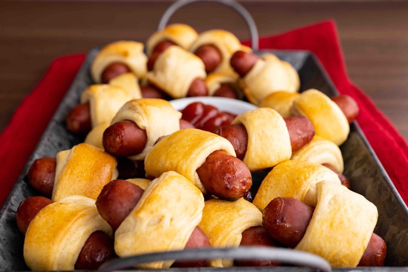 Pigs in a Blanket in serving tray with ketchup