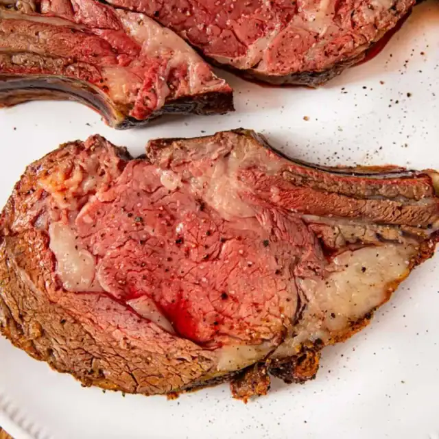 Slice of prime rib on a white plate