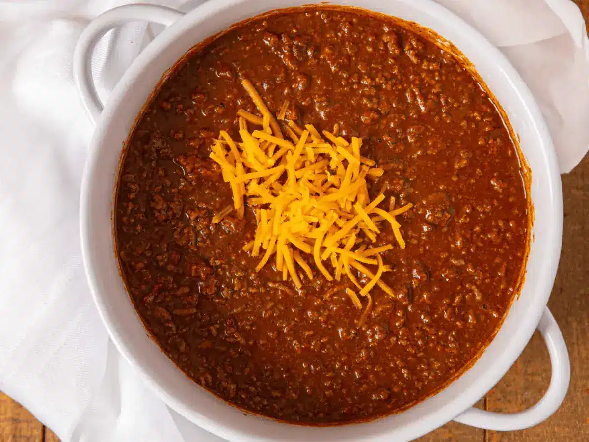 Pot of chili with shredded cheese