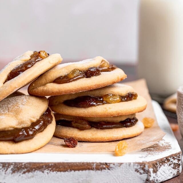 Raisin Filled Cookies stacked on cutting board 1x1