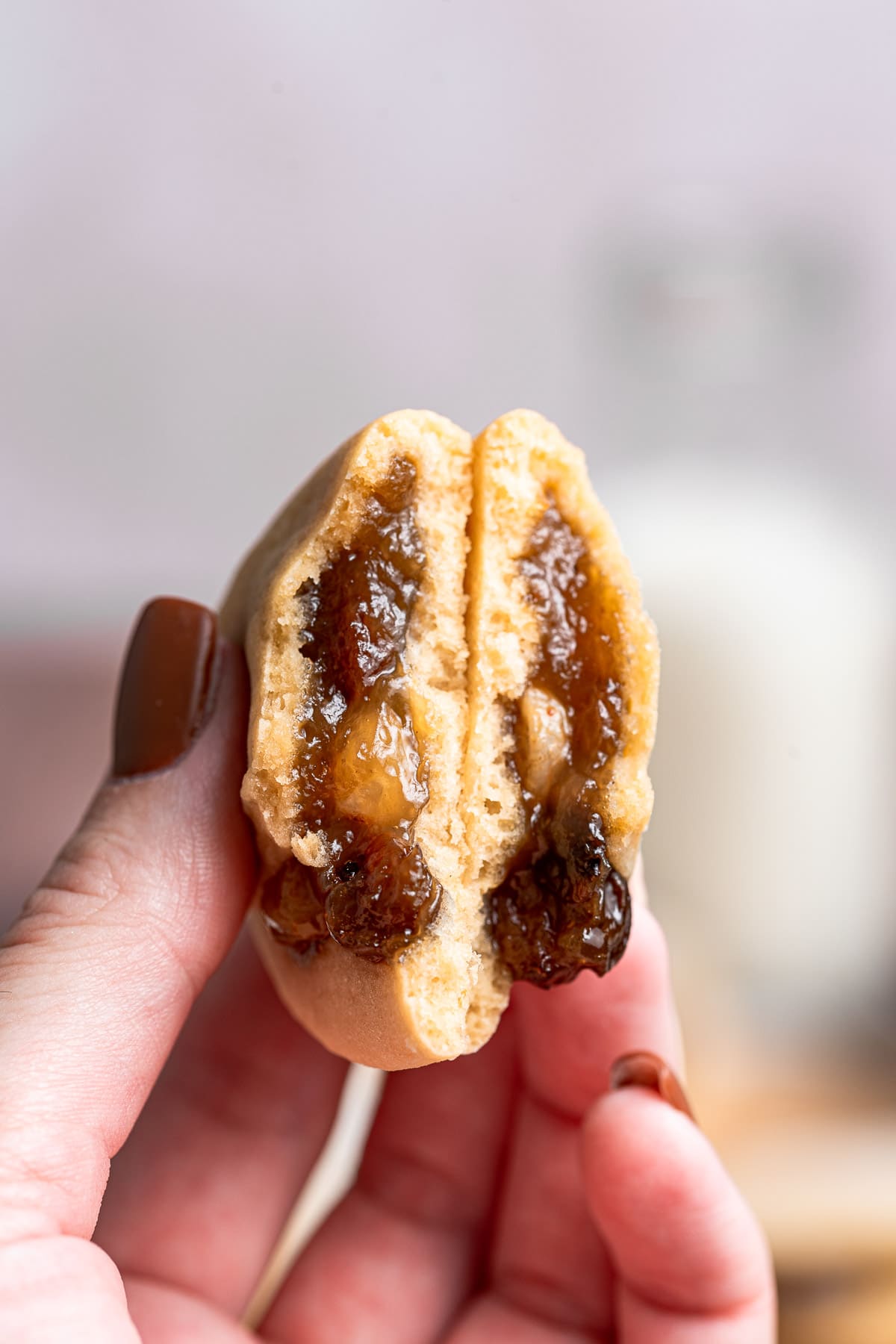Raisin Filled Cookies in hand showing interior