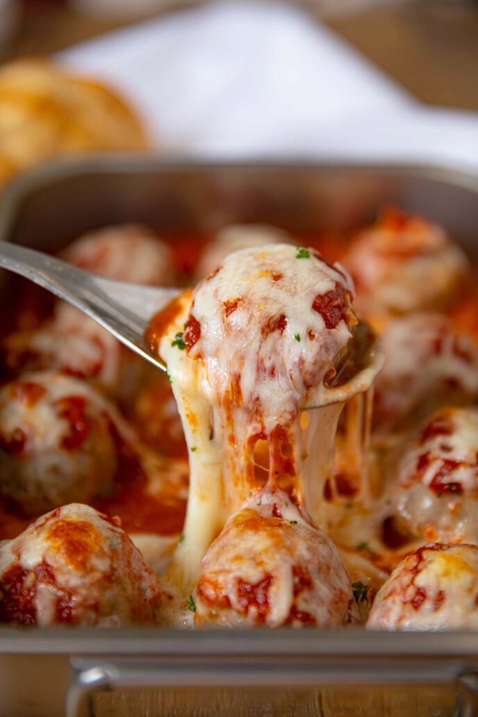 Cheesy Meatball Casserole large scoop with spoon