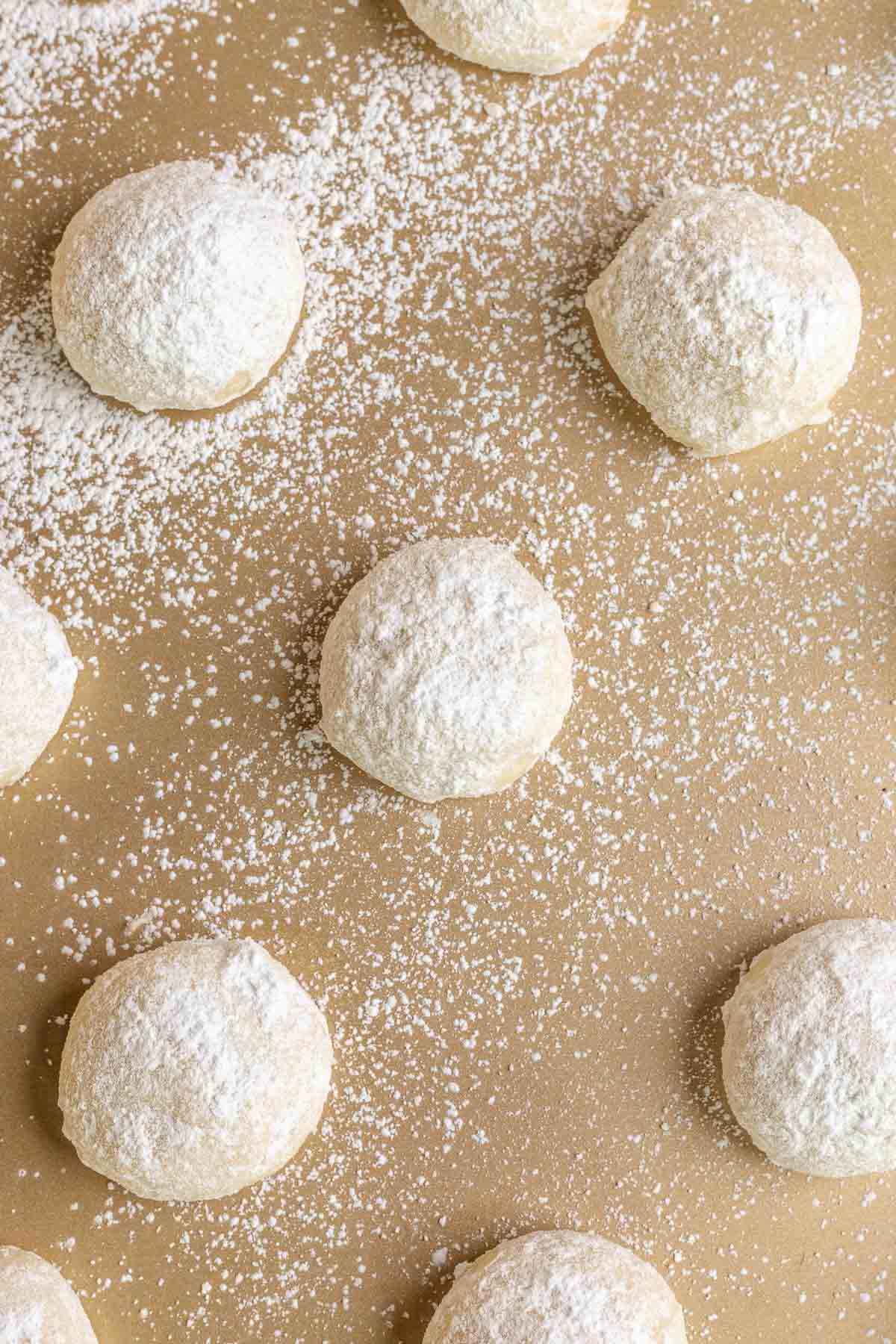 Cherry Snowballs cookie dough rolled on cookie sheet unbaked rolled in powdered sugar