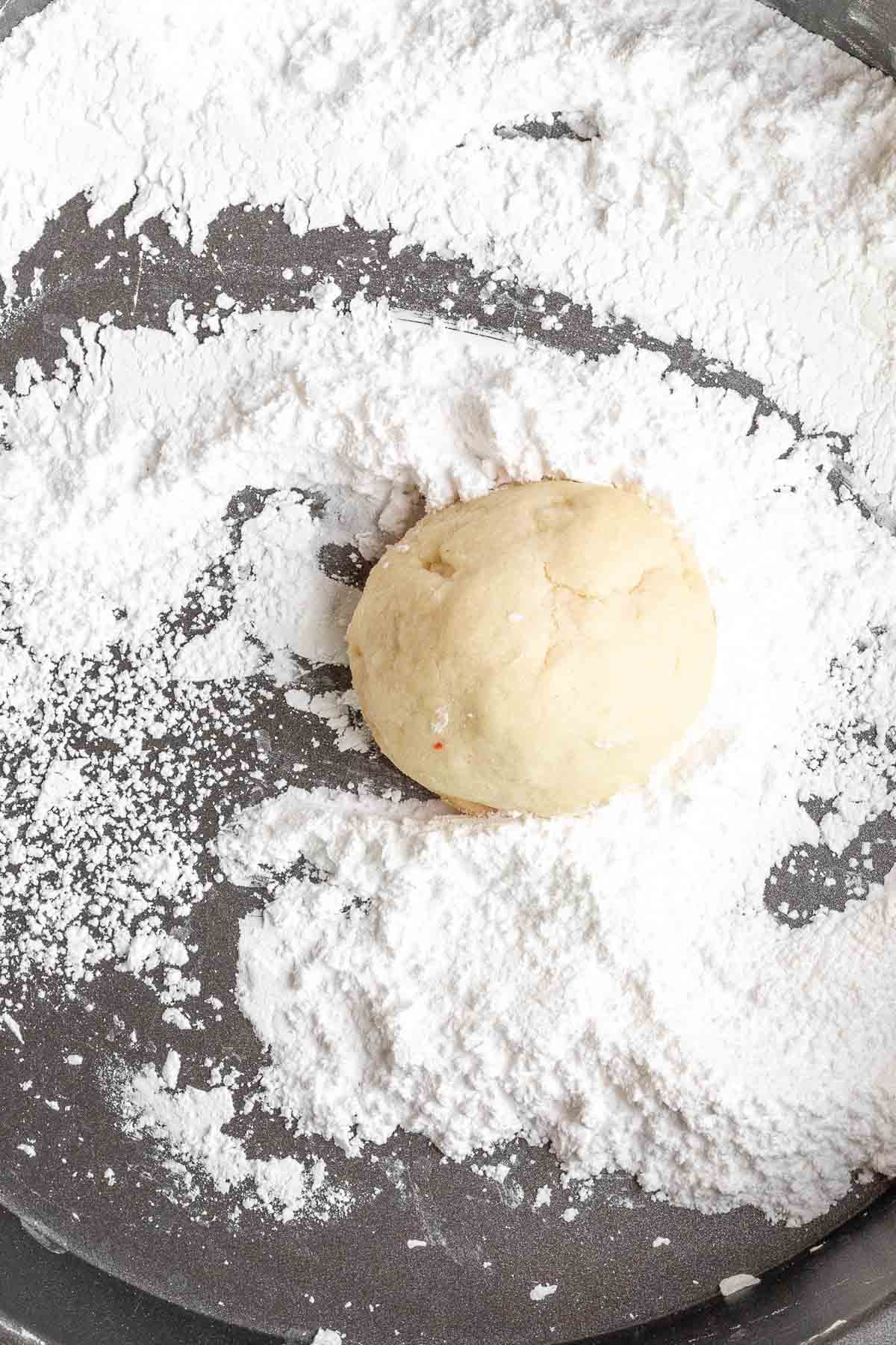 Cherry Snowballs cookie dough rolled unbaked in powdered sugar