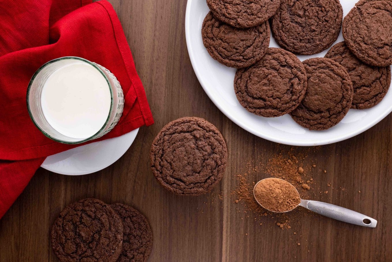 Chocolate Cookies on serving plate with glass of milk