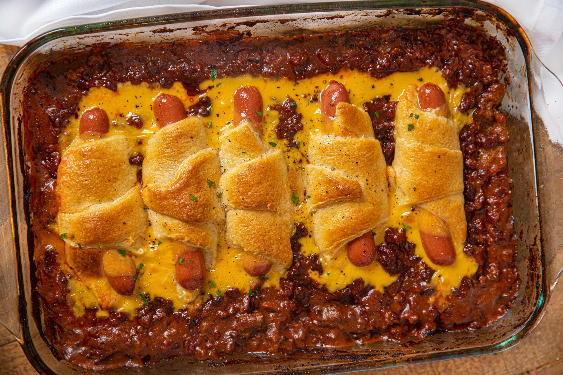 Casserole with chili dogs in baking dish