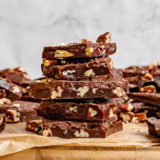 Gingerbread Toffee pieces stacked on a cutting board