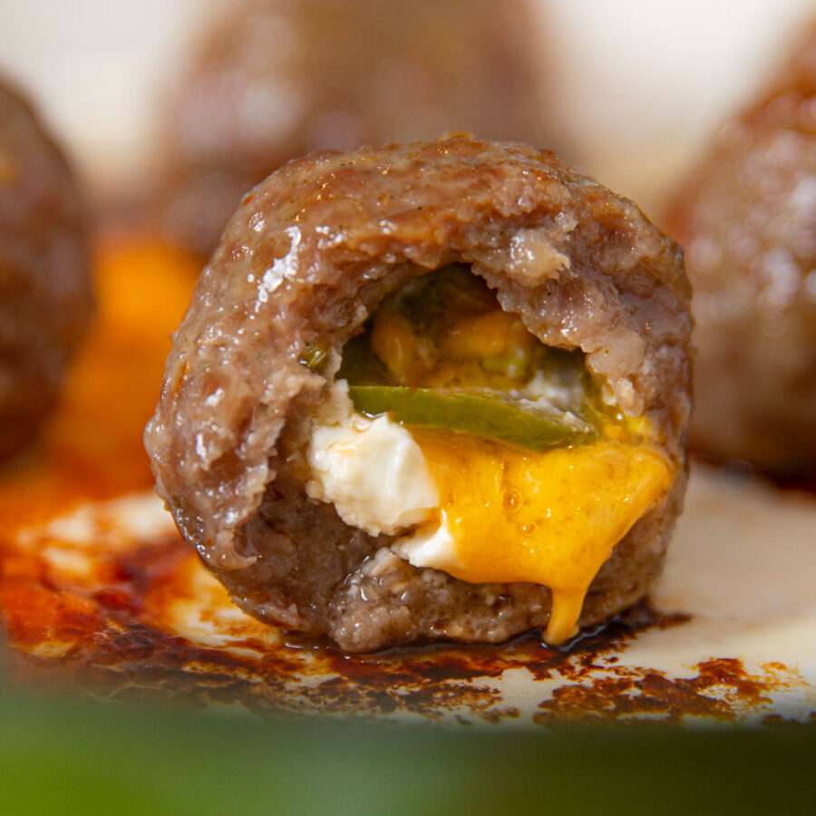 Jalapeno Popper Stuffed Meatballs in green pan