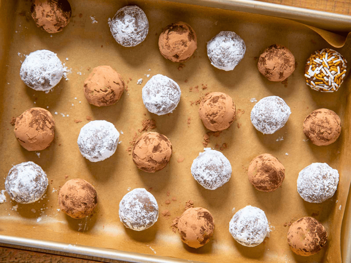 rolled up alcoholic chocolate treats on a baking sheet