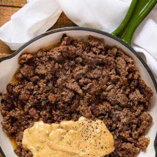 Sandwich meat and sauce in pan